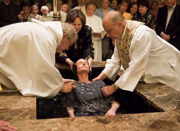 Jennifer Black, being baptized.  Photo by Don Doll, S.J.
