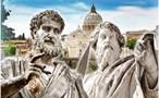 Statues of Saint Peter and Saint Paul with St. Peters Basilica in the background